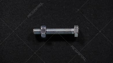 Screwing nut on bolt