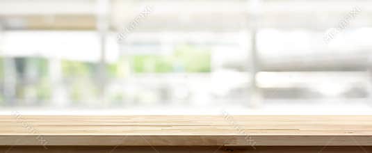 Wood table top on blur kitchen window background