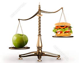 Apple and hamburger on scales conceptual