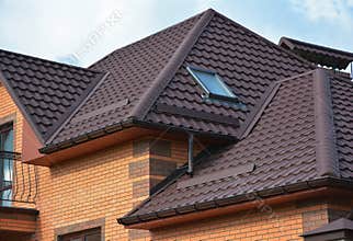 Roofing construction with attic skylights, rain gutter system and roof protection from snow. Hip and Valley roofing types.