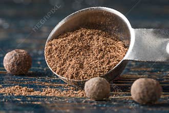 Ground Allspice Spilled from a Teaspoon