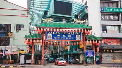 KUALA LUMPUR, MALAYSIA - OCTOBER 4, 2015: Chinatown gate at Petaling Street hyperlapse.