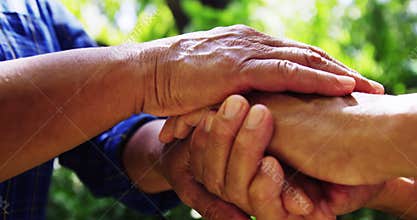 Senior couple holding hands