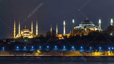 Hagia Sophia and Blue Mosque timelapse at night reflected in Bosphorus water. Istanbul, Turkey