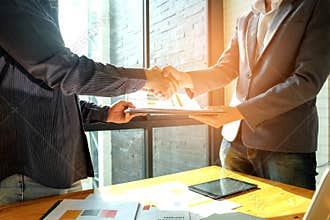 Businessmen shake hands when entering into business deal,In the