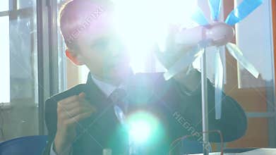 Close-up. Little Genius Comprehend alternative energy. School science concept.