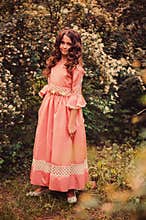 Child girl in fairytale princess dress on the walk