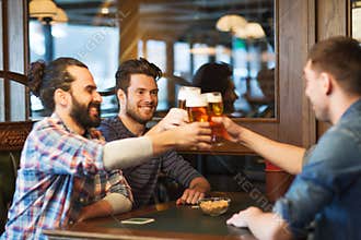 Happy male friends drinking beer at bar or pub