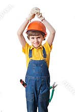 The boy wears hardhat and holds hands above head