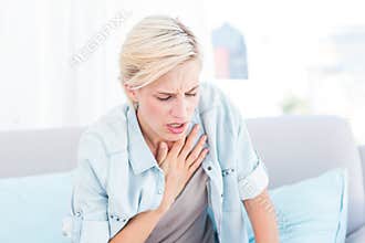 Pretty blonde woman having breath difficulties