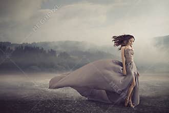 Sensual woman walking on the fantasy ground