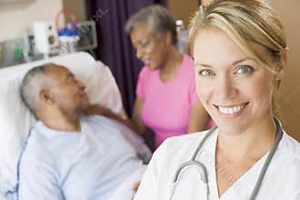 Doctor Standing In Patients Room