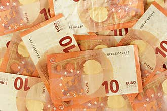 10 euro banknotes scattered closeup