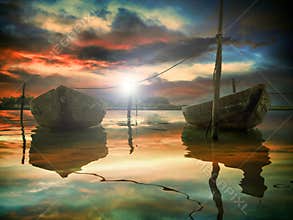 The sunset and two fishing boats