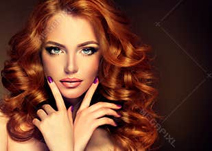 Girl model with long curly red hair.