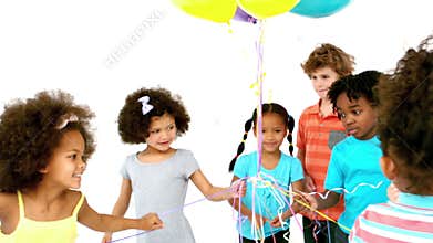 Happy children playing with balloons