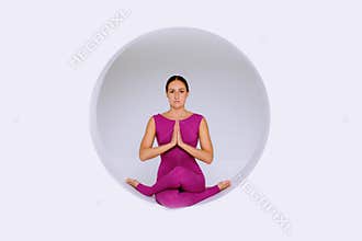 Doing yoga exercises in creative studio