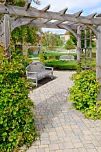 Stone Path Under Wooden Arbor