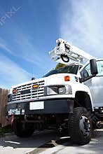 Big white diesel truck with boom