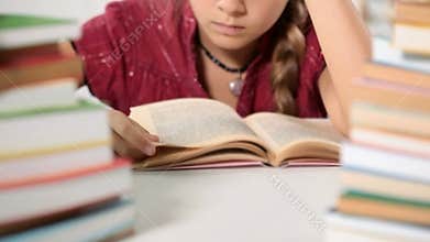 Little girl reading her book - closeup