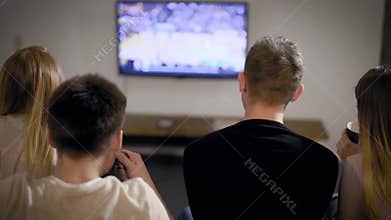 Young man and woman watching TV