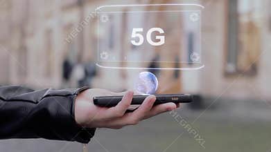 Male hands show on smartphone conceptual HUD hologram 5G
