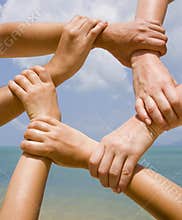 Many hands connecting to a chain