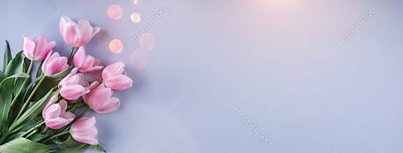 Bouquet of Pink tulips flowers over light blue background. Greeting card or wedding invitation