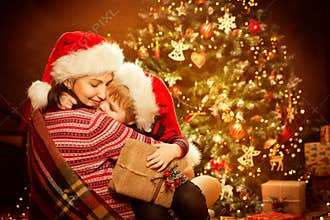Christmas Family and Xmas Tree, Happy Mother give Baby Child New Year Present Gift