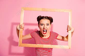 Portrait of her she nice cute charming attractive glamorous aggressive girl in striped t-shirt holding in hands wooden