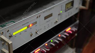 Radio station. Professional multitrack mixing console, computer and microphone in the control room. Recording and broadcasting pro