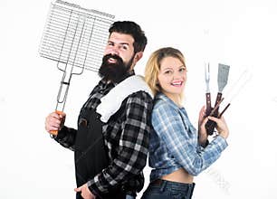 A better grill for a better cook. Happy hipster and sexi girl holding picnic set for barbecue. Family couple having