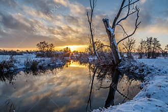Winter scene: sunrise at the river