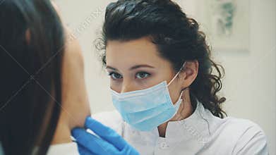 Young woman sitting in a dental chair for appointment of a doctor. During this time, she was very worried about fear