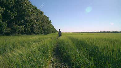 Woman stroll with french bulldog at field.