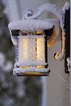 Frosty Porch Lantern after Fierce Winter Storm