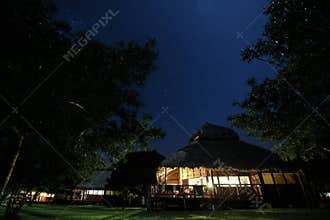 Thatch roof chalet in Mozambique at night