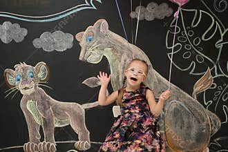 Beautiful girl with Down`s syndrome celebrates its birthday
