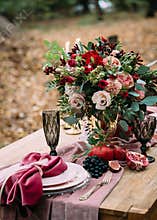 Rustic wedding decoration for festive table with beautiful flower composition. Autumn wedding. Artwork