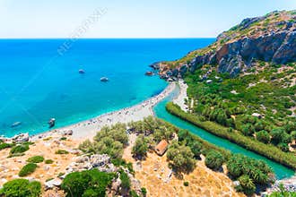 Panorama of Preveli beach at Libyan sea, river and palm forest, southern Crete.