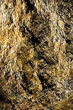 Gold textured rock surface