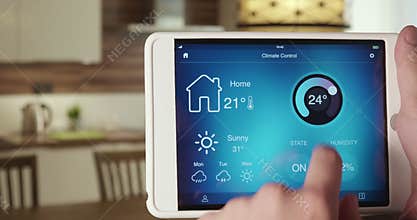 Controlling temperature in the house using app on the digital tablet