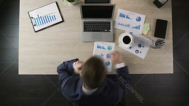 Busy active man working at office, typing on laptop, calling clients, timelapse