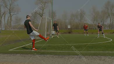Young soccer player performing corner kick