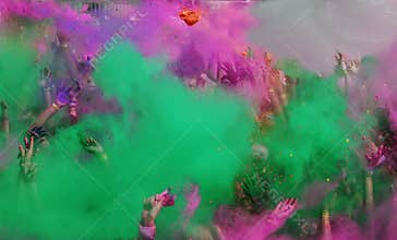 Color Run dust and hands in the air