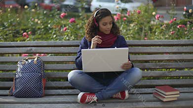 Appealing girl listening to favorite relaxation music, looking for inspiration