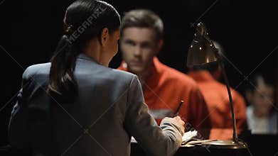 Criminal man and lady prosecutor discussing defense line and imprisonment terms