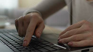Female hands typing slowly on keyboard, unconfident computer user studying