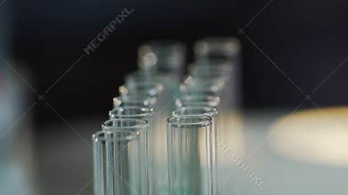 Researcher taking test tubes with blood, scientist doing biochemical analysis