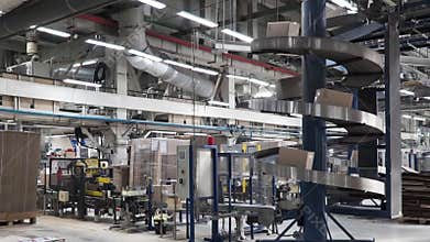 Logistic and distribution warehouse. Clip. Empty warehouse full of cargo. Cardboard boxes. Rows of shelves with paper